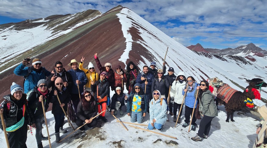 Travelers ascending Vinicunca trail near 5000 meters