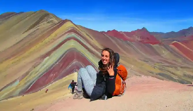 Hikers walking toward Rainbow Mountain Peru summit