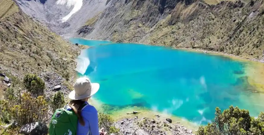 travelers resting during Humantay Lake hike altitude - Magical Cusco Travel Agency