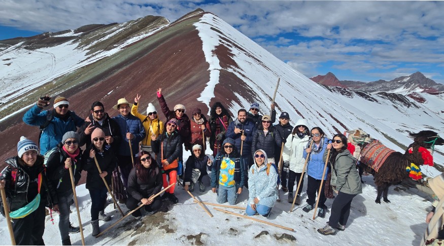 Visitors wearing thermal layers at Rainbow Mountain Peru