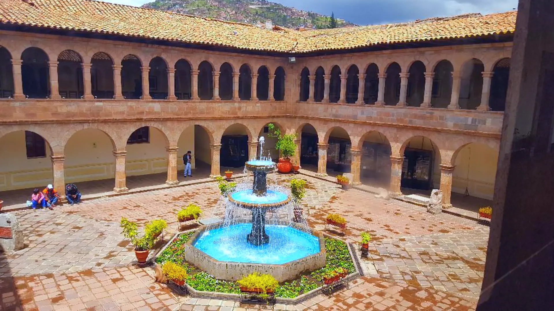 Colonial-style courtyard with central fountain and arched walkways inside the Contemporary Art Museum in Cusco – Magical Cusco Travel Agency
