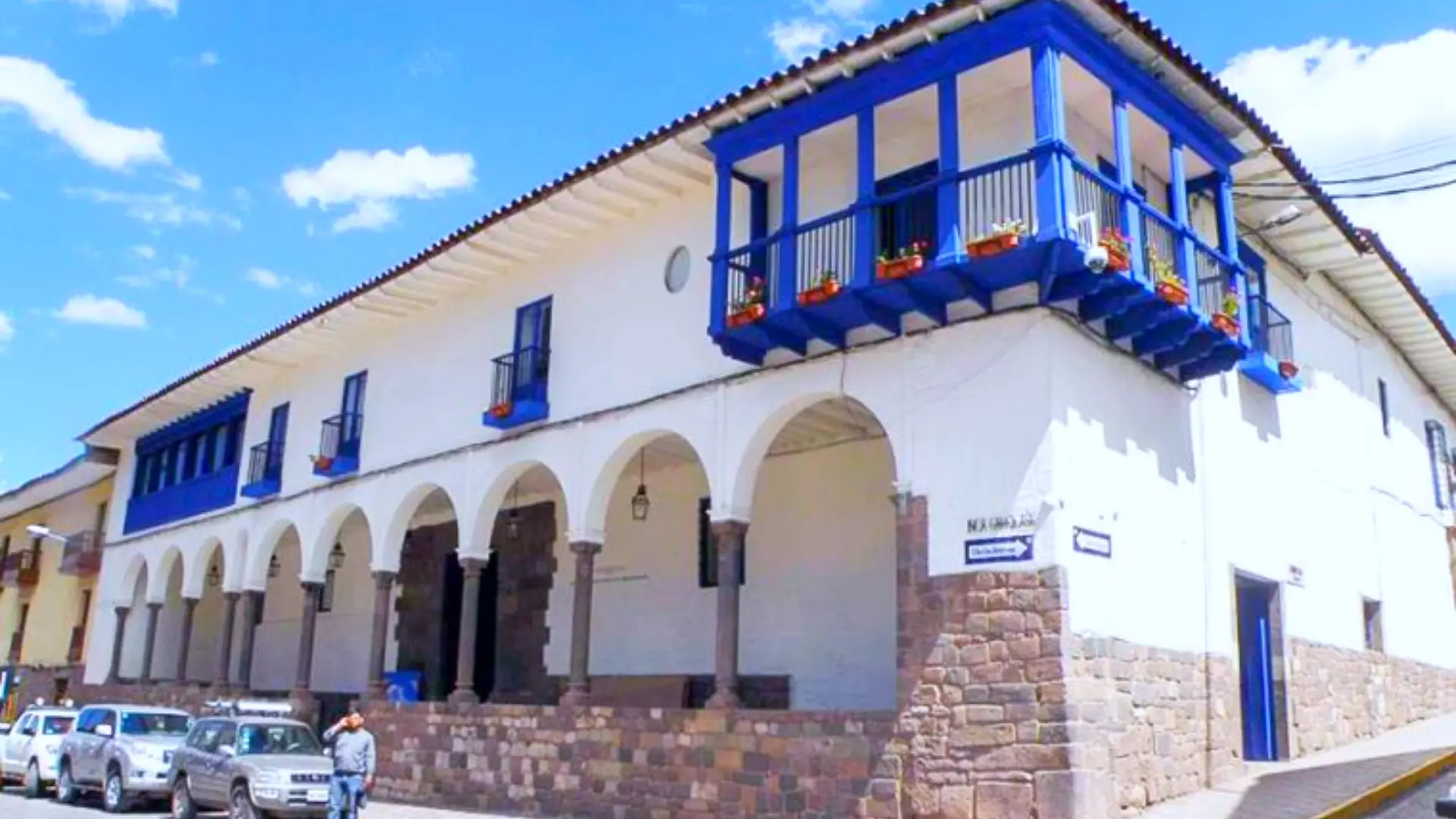 Colonial building with blue balcony and stone arches housing the Regional Historical Museum on Calle Maruri in Cusco – Magical Cusco Travel Agency