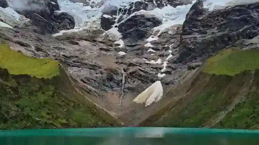 Mountain landscape with glacier and lake in Cusco, Peru.